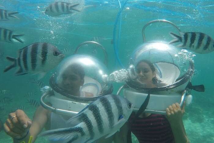 Couple enjoying Underwater Seawalking in Mauritius