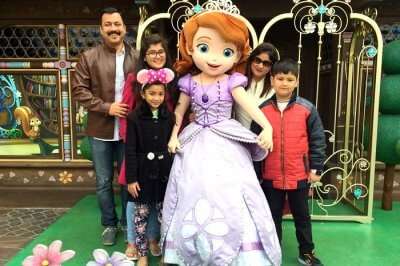 Vivek and his family in Disneyland Hong Kong