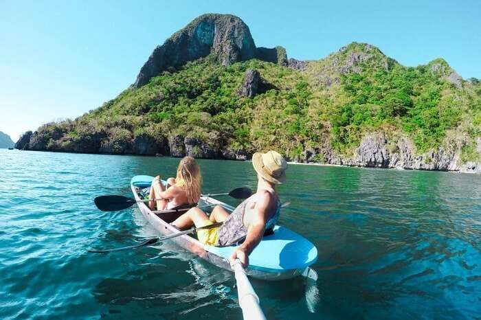 Canoeing couple in Palawan