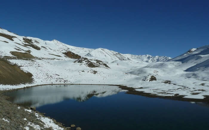 Suraj Tal Lake in Spiti with snow around