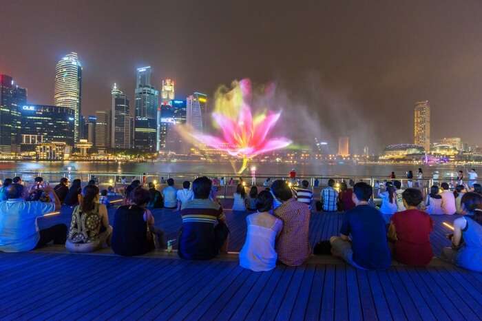 People watching the light & water show at Marina Bay Singapore