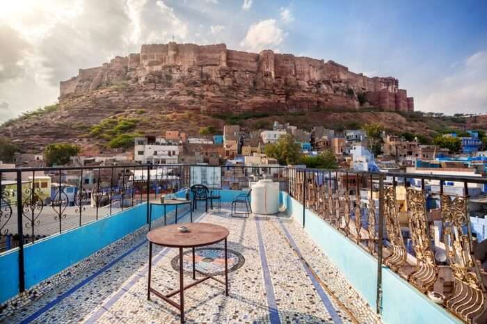 Rooftop cafe with view to Mehrangarh Fort on a cloudy day