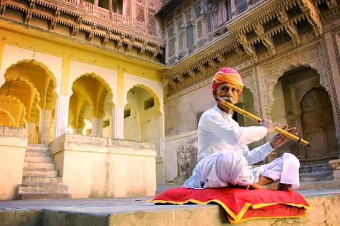 A flautist playing outside Jodhpur Fort