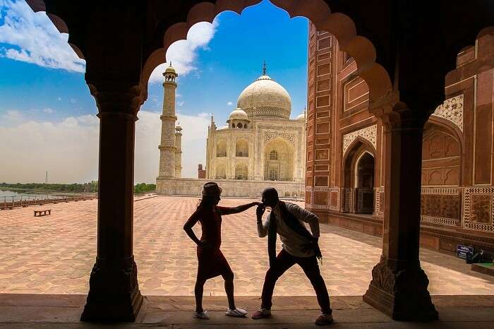 A couple during a photo shoot at Taj Mahal on their honeymoon