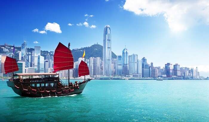 Boat cruises through Harbor City Hong Kong