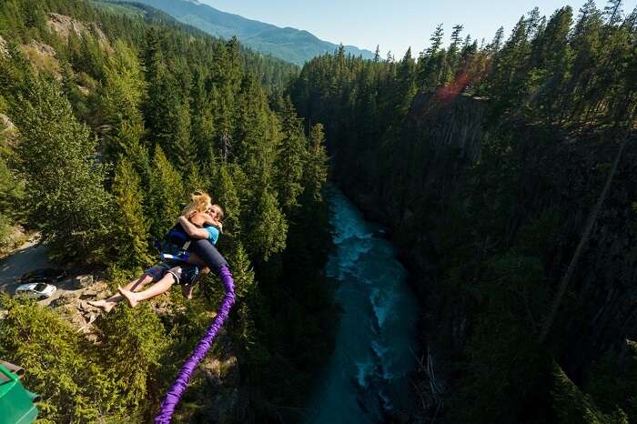 Couple bungee jumping in USA