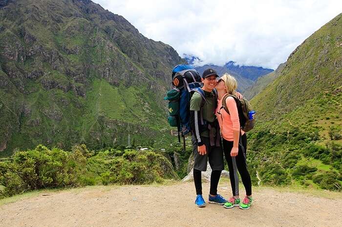 Romantic couple trekking on honeymoon