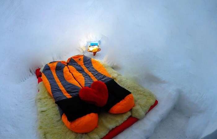 A sleeping bag on the bed inside the igloo in Manali