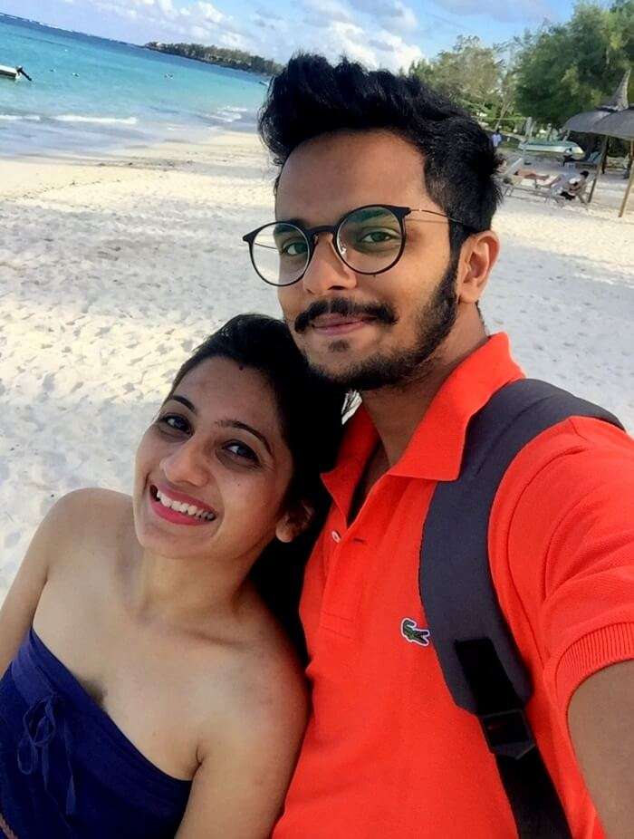 Malay and his wife on a hotel beach