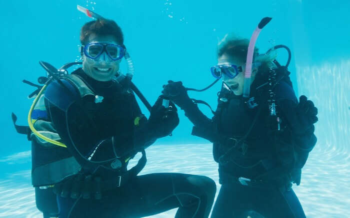 A couple scuba diving