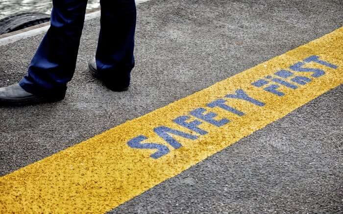 Safety tips written on a road in Thailand