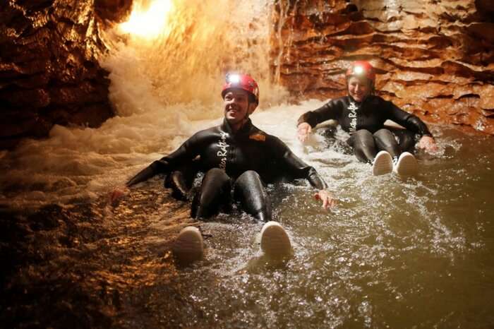 Adventurers taking up adventure activities inside Ruakuri Cave