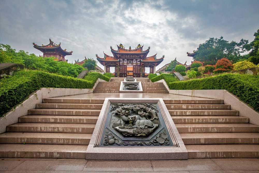 Chinese-style building with carved images on stairs