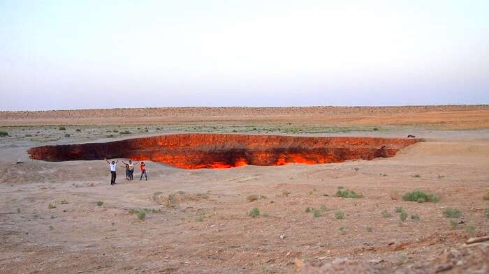 Anand and his family at the Door to Hell in Turkmenistan