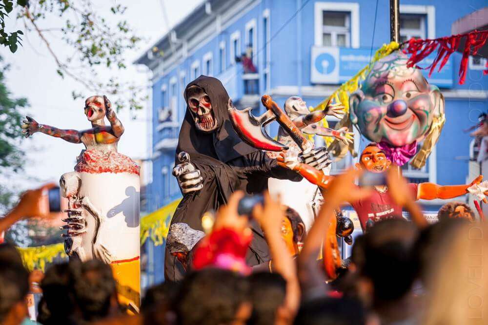 people wearing scary masks in Goa carnival