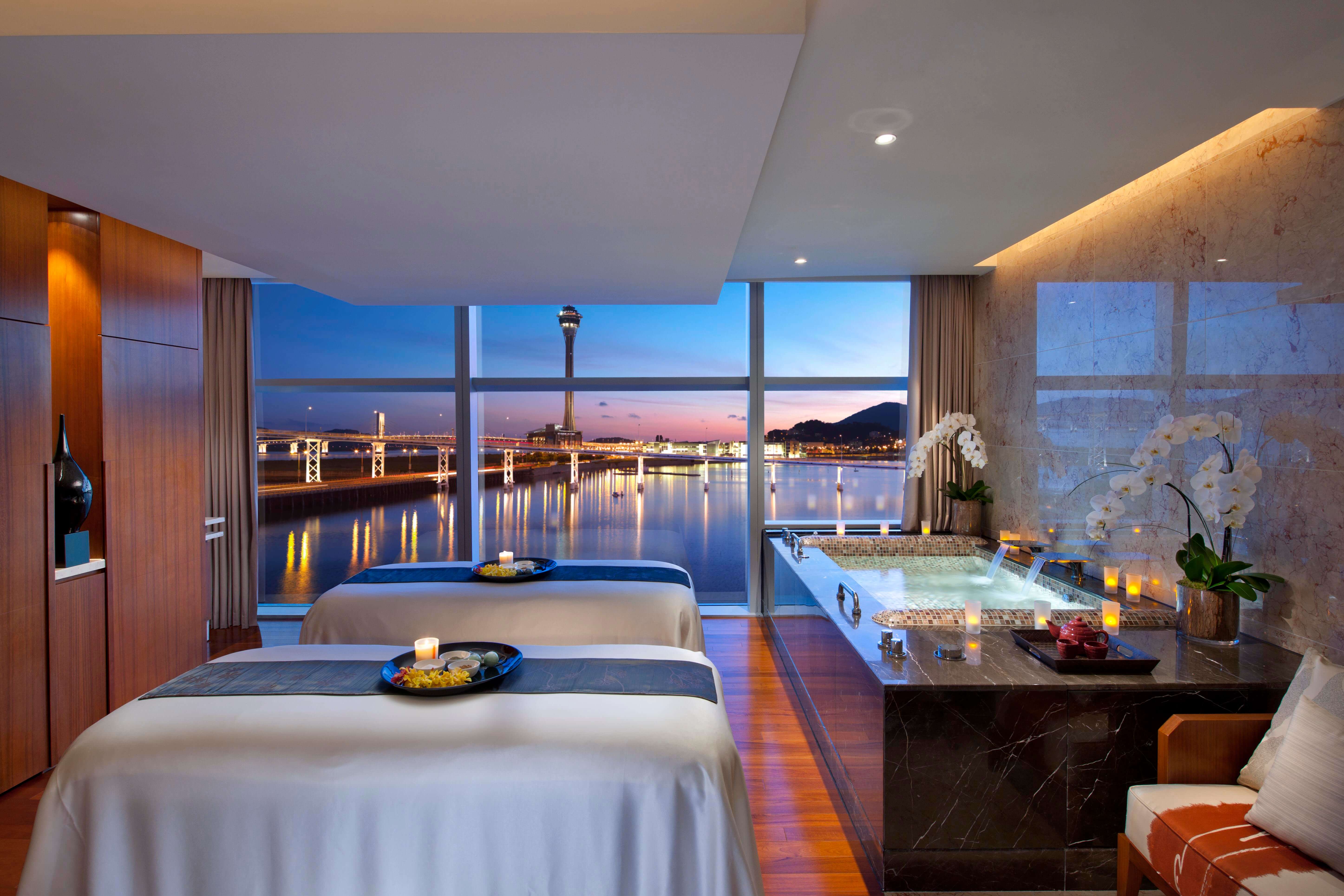 Spa treatment room with a luxury bathtub