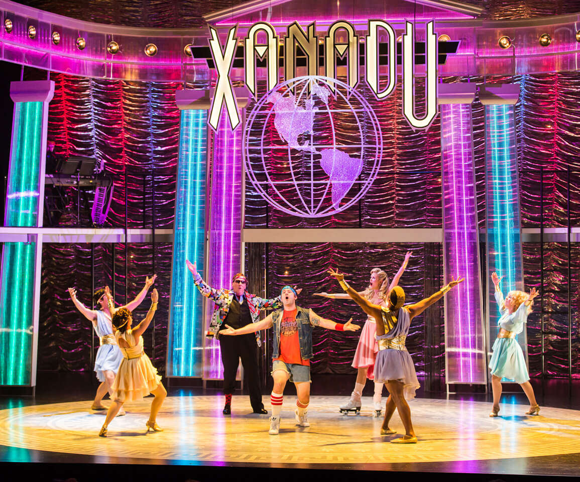 artists performing on the stage of Xanadu