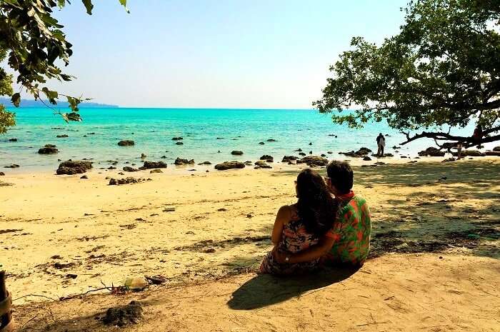Couple sitting on the beach in Andaman
