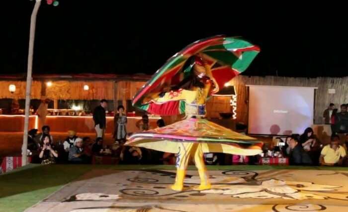 Dancer performing during desert safari in Dubai