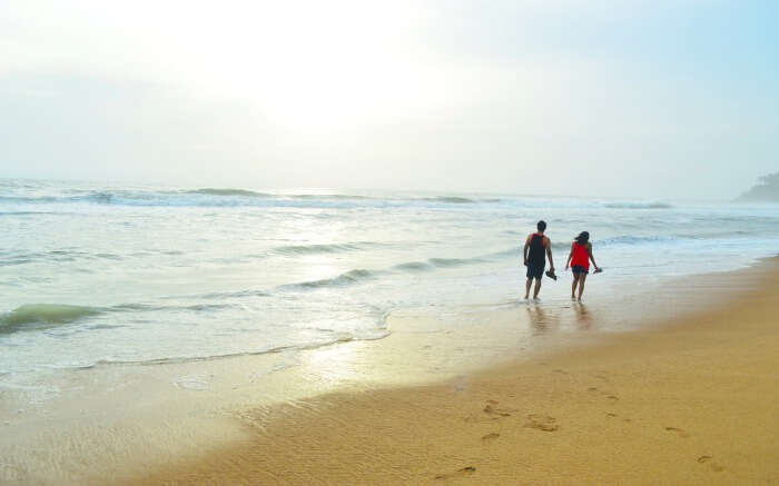 A couple on a beach in Kerala