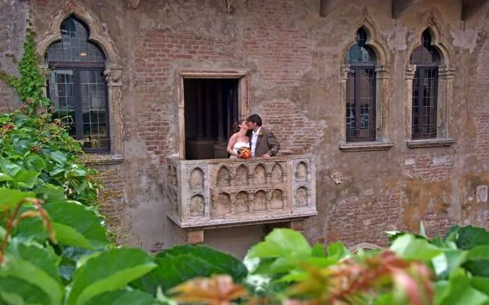 A couple in Juliet's Balcony