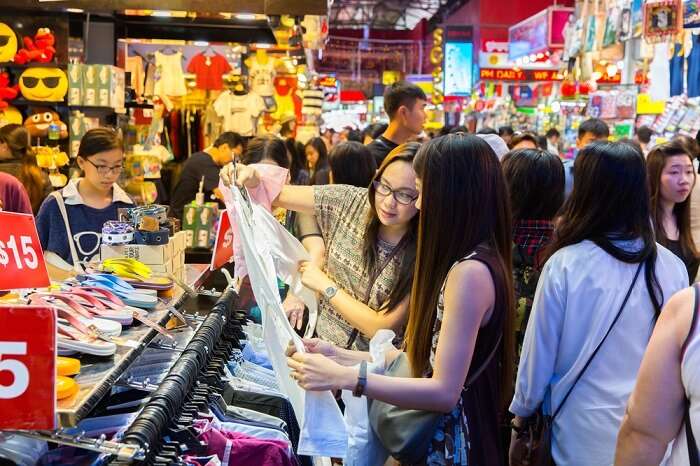 a girl shopping in Singapore flea market