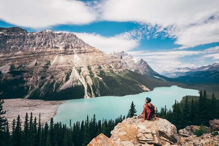 solo female traveler trekking on the Canadian rockies