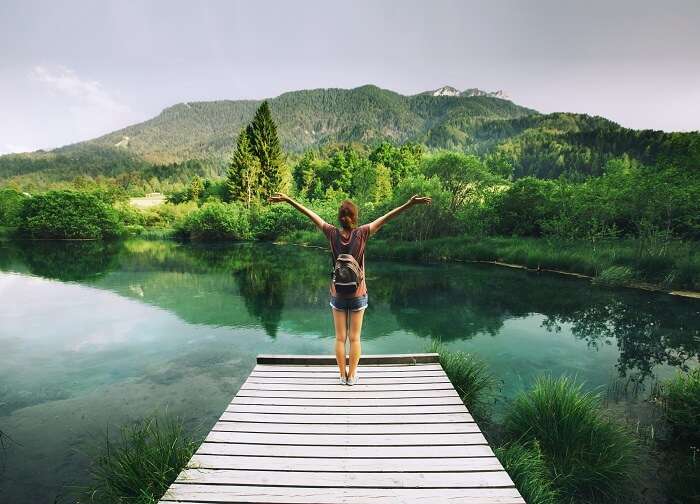 solo female traveler admiring nature in Slovenia