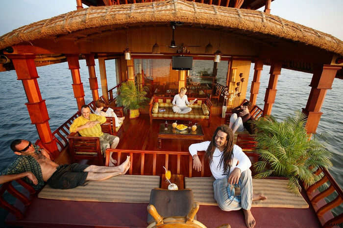 tourists relaxing on a luxurious houseboat