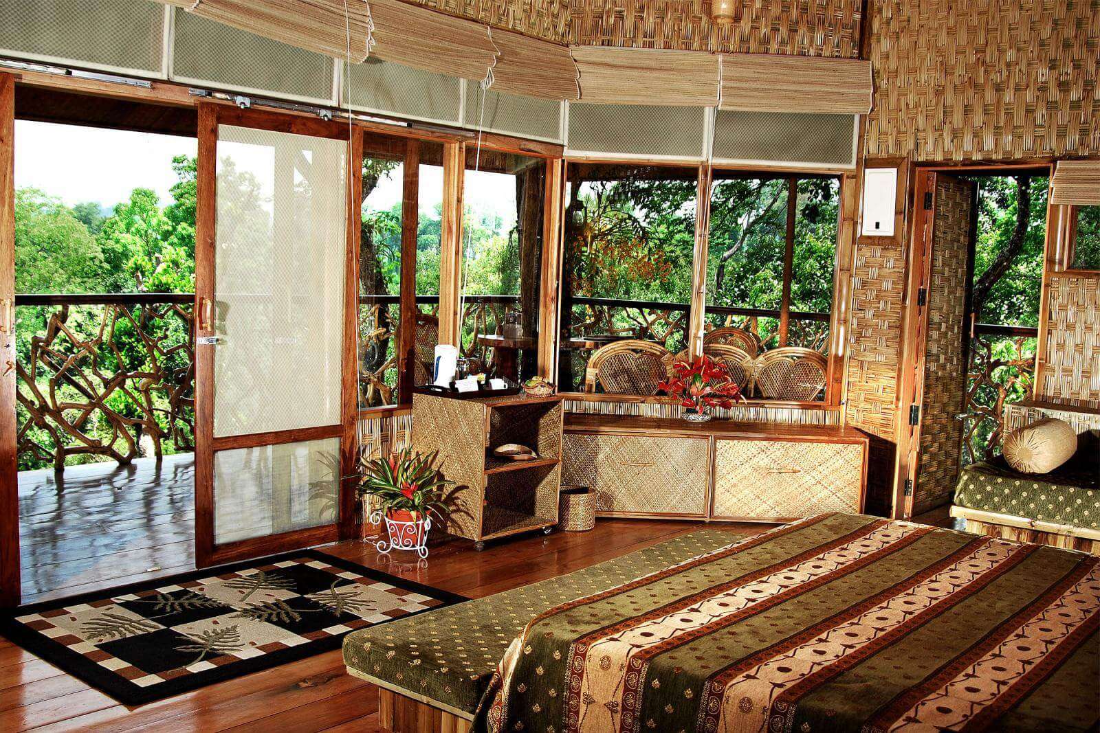 a resort room with glass window