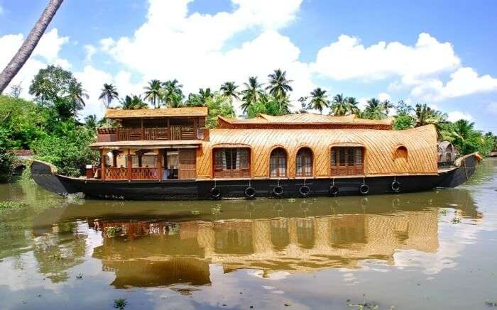 A view of Amrutham Houseboat sailing in the backwaters of Kumarakomss