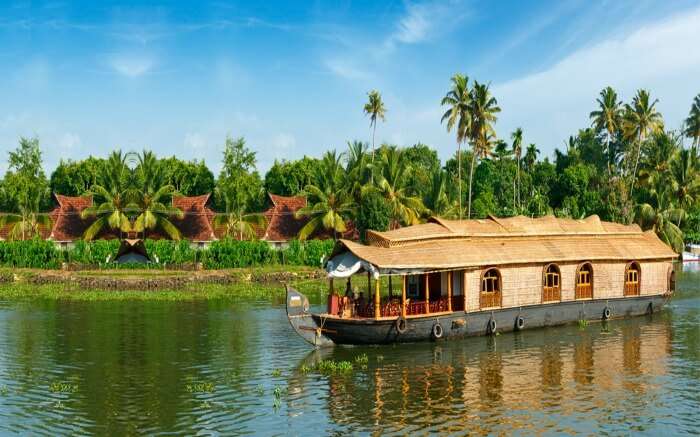 A view of Thathwamasi Premium Houseboats in the backwaters of Kumarakomss