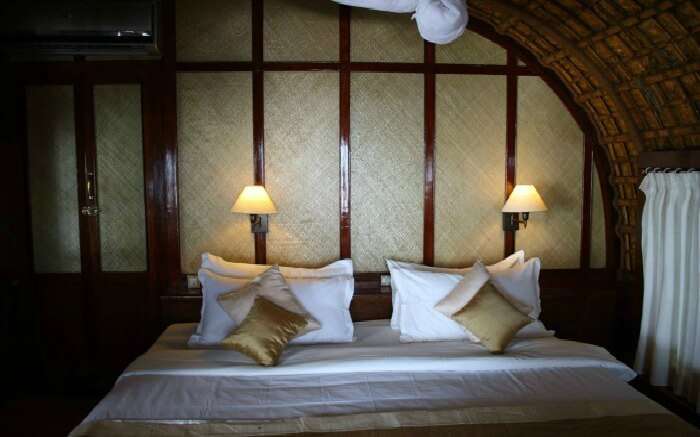 A well laid-out bedroom of Spice Coast Cruises in Alleppey