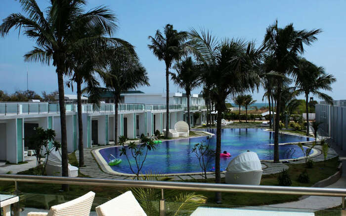 Dining area overlooking pool at L’attitude in Mahabalipuram in Chennai