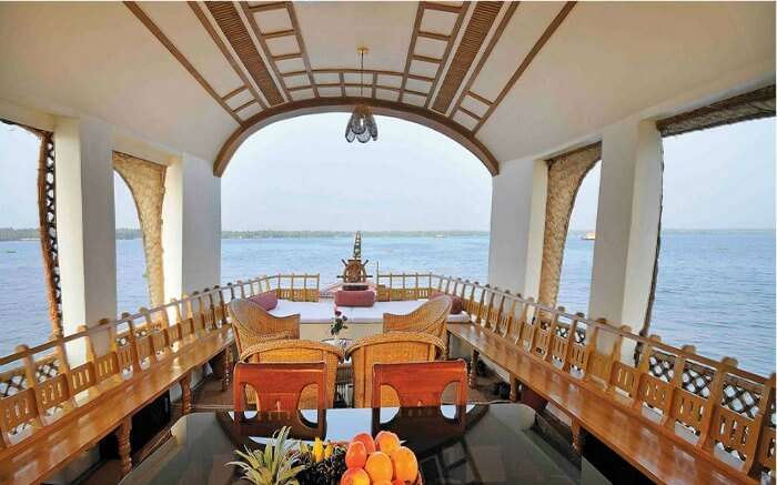 Dining space of a Kumarakom houseboat in Keralass