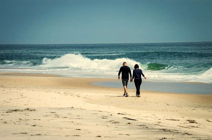 couple walking on beach in jersey