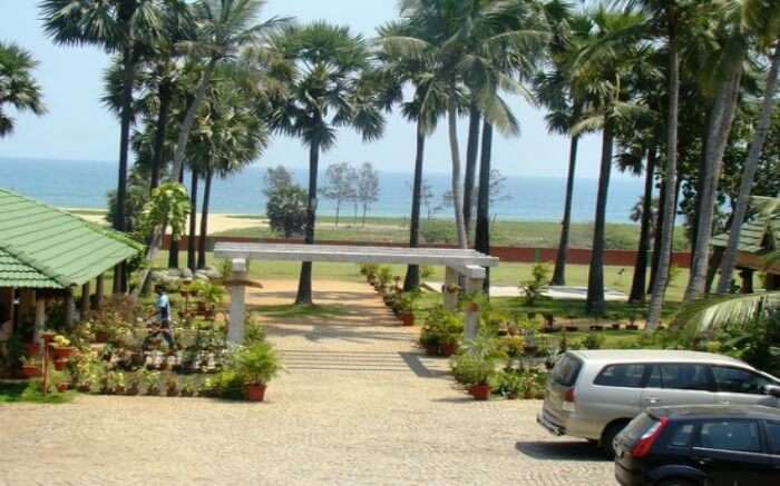 Lawn area of Nalla Eco Beach Resort overlooking sea in Pondicherry