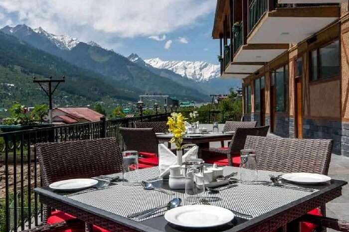 Open roof dining of Anantmaya in Manali overlooking mountains
