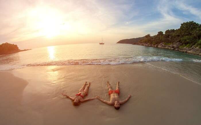 A couple on a beach in Thailand