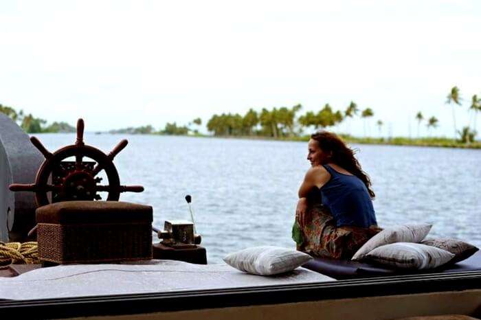 Traveler sitting on the front deck of the Olala Cruise