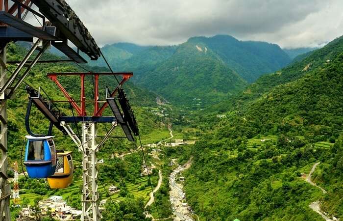 Cable car ride in lush green valley in Dehradun in Uttarakhand