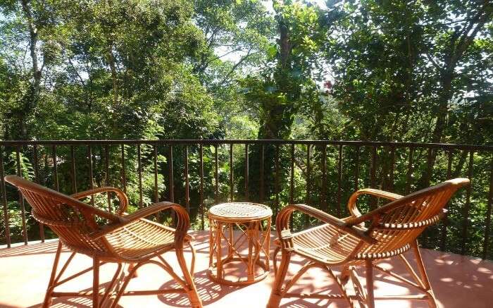 bamboo chairs and table in a balcony in Chrissies hotel in Thekkady ss25042017