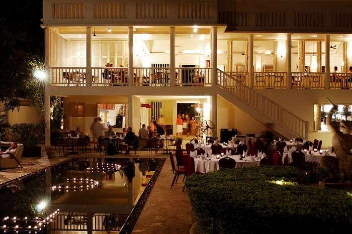 Locals and tourists relax and enjoy drinks on a summer evening at FCC Cambodia