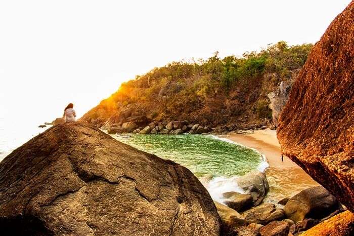 A splendid shot of a beautiful sunset at the Butterfly beach in Goa