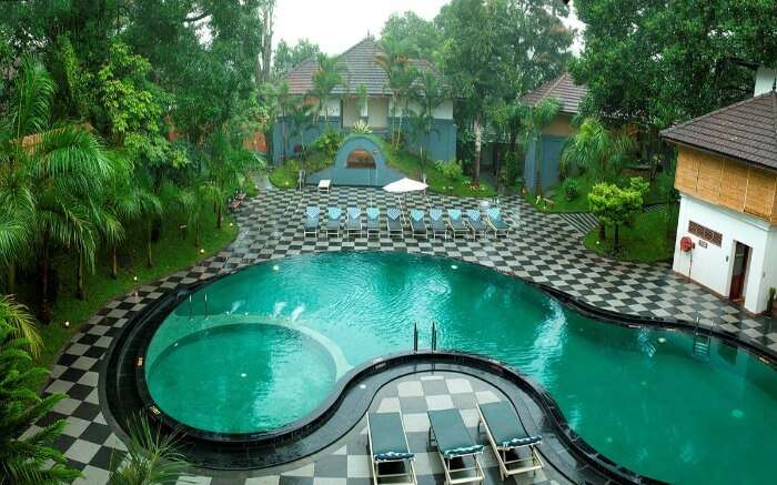 outdoor pool of the Elephant court hotel in Thekkady 