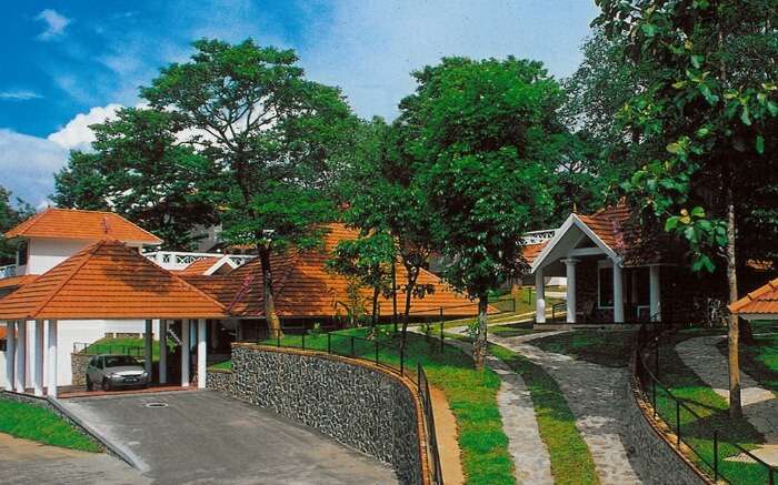 red and white painted bungalows of Hotel Treetop in Thekkady 