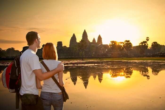 A couple at Angkor Wat at sunrise