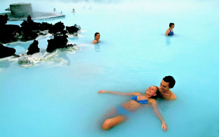 Couple enjoying romantic bath in Blue Lagoon in Iceland 