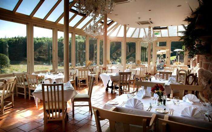 Dining area in Dalhousie Castle hotel in Scotland