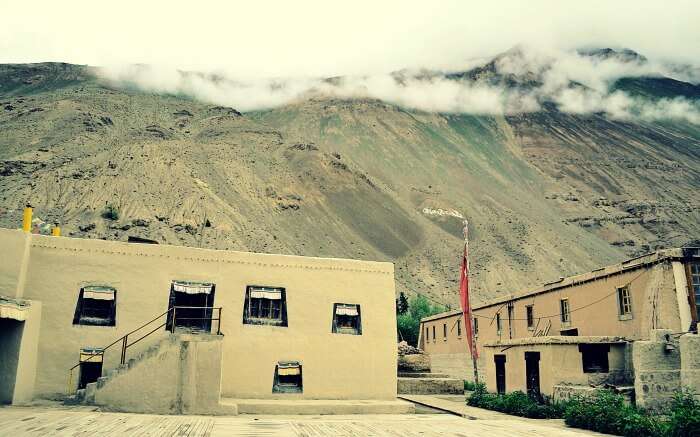 Inside Tabo monastery in Spiti along with barren mountains background 